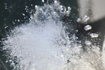 Blurred background of ice in a glass. Abstract Christmas background.