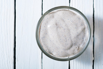 organic skin care butters from, shea, macadamia nut, coffee, mango, and cosmetic clay, mud on white wooden