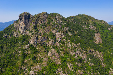 Fototapeta na wymiar Hong Kong lion rock mountain with clear blue sky