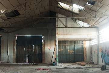 Abandoned dirty industry building with graffiti
