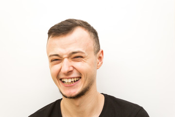 emotion joy, young man on a white background, human emoji