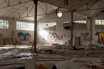 Abandoned dirty industry building with graffiti