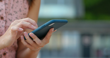 Close up of woman use of mobile phone at outdoor