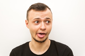 Obraz premium emotion dog, young man on a white background, human emoji