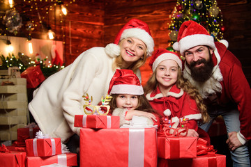 Obraz na płótnie Canvas Happy holidays. Spend time with your family. Friendly family winter vacation. Family tradition. Parents and children excited about christmas. Bearded man and mother with cute daughters christmas eve