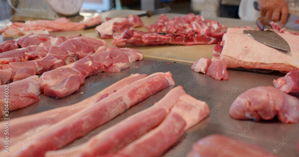 Sticker sell raw fresh pork in wet market