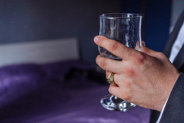 Handsome man holding a glass of wine