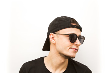 emotion angry, young man in black cap and black glasses on a white background, people emoji