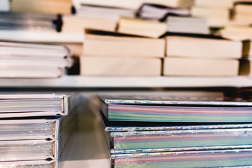 Books for sale on the shelves of a bookshop, viewed from above.