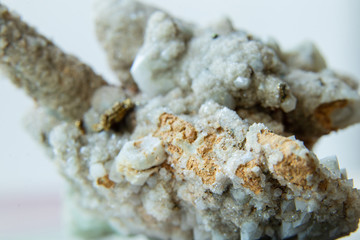 Quartz stone druse crystals small isolated in the light. The texture of small quartz crystals....