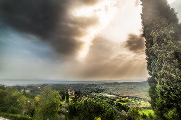 Dark clouds over the countryside in Tuscany