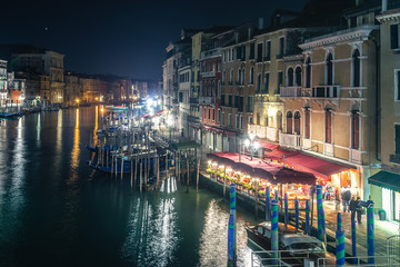 Venice's Grand Canal under a clear sky at night