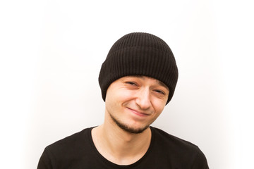 emotion frowning, young man in a black cap on a white background, man emoji