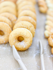 Close up sweet donuts on shelf for sale in the shop food and drink backgrounds