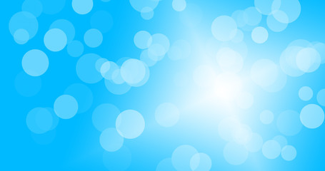 Bokeh on blue background with light from bottom right