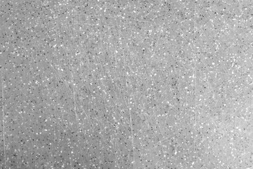 Gray wall with black spots and scratches background texture. abstract surface