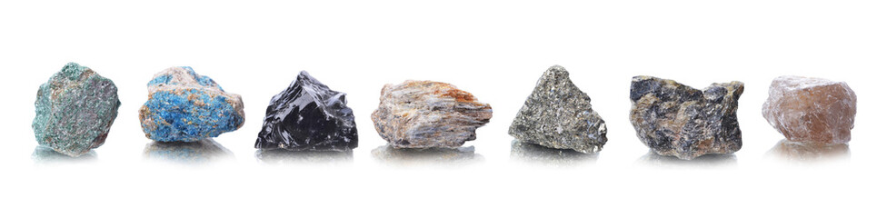 macro shooting of natural mineral rock specimen -  Fuchsite, apatite,obsidian,cyanite ,pyrite,Labradorite,smoky quartz,stone on an isolated white background,reflection