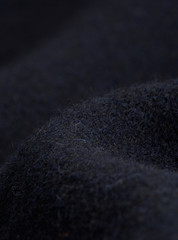 Textile - Fibers close-up showing paterns of the fabric. Soft background and ondulations creating shadows and volumes