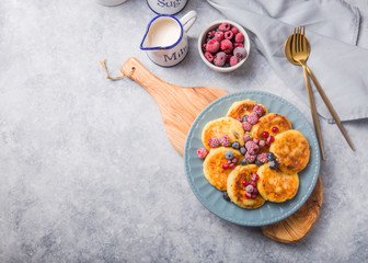 Breakfast with cheesecake,  fresh berries .  Cottage cheese pancakes or curd fritters. Russian syrniki or sirniki