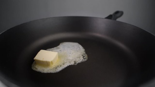 Butter is melting onthe hot pan in slow motion, preaprations for roasting, hot grill, cooking with milk products, Full HD 240 fps Prores 422 HQ