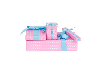 Group of Christmas or other holiday handmade present in pink paper with blue ribbon. Isolated on...