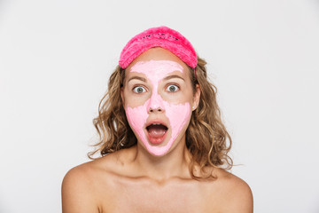 Image of surprised half-naked woman looking at camera