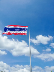 Image of waving Thai flag of Thailand with wind on blue sky background