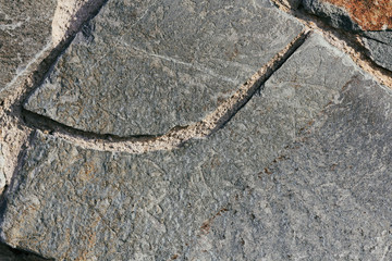 Concrete wall texture background. Natural stones. Building's facade decor. Decorative plaster. House exterior.	