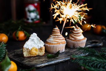 Citrus cupcakes with lemon curls and a cap from Swiss meringue