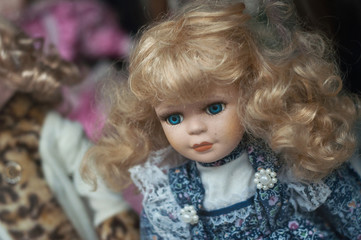 Closeup of vintage doll at flea market in the street