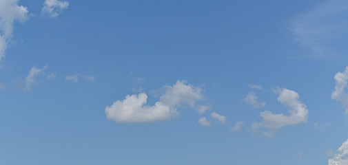 White cloud with blue sky background.