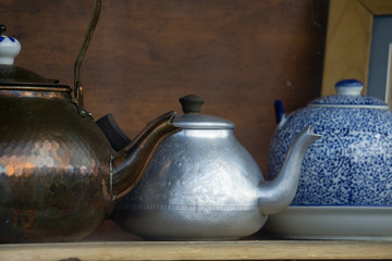 Brass, copper and porcelain vintage and antique teapots. 