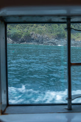 Fototapeta na wymiar sea surface view from yacht cruise window at Phuket, Thailand