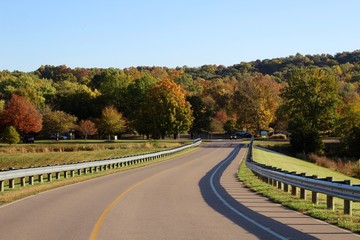 The winding country road on a bright sunny fall day.