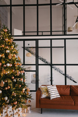 The interior of the living room with a Christmas tree and gifts