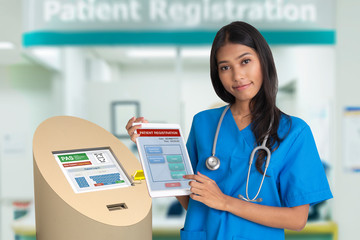 Female doctor showing health information service technology for patient registraion.