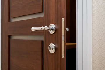 Obraz premium walnut door with white trim in the hallway and details