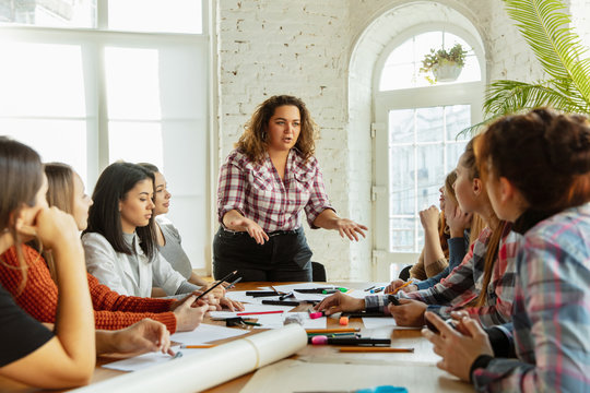 Teamwork. Young people discussing about women rights and equality at the office. Caucasian businesswomen or office workers have meeting about problem in workplace, male pressure and harassment.