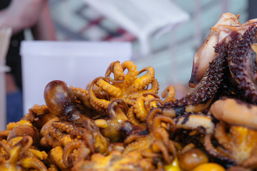 Grilled Octopus for sale in local street food fresh market. Bangkok, Thailand.