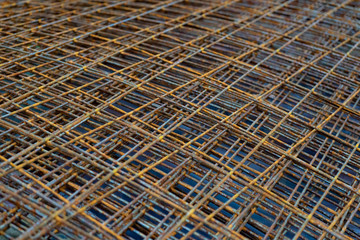 A pile of old rusty rebar, grill. Rusty metal bars.