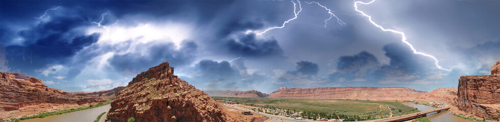 Fototapeta premium Panoramic aerial view of Colorado River in Moab area close to Arches National Park during a storm