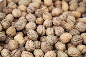 closeup of  walnuts on display at the market