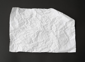 Obraz premium crumpled white paper isolated on black background. can use text banners products or business cards your.