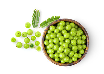 Indian gooseberry in wood bowl on white background. top view