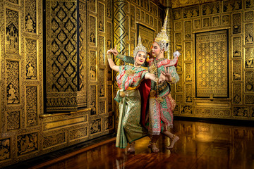 The character Phra and Nang dancing in a Thai pantomime performance.