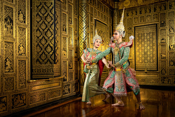 The character Phra and Nang dancing in a Thai pantomime performance.