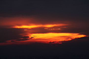 A dramatic red yellowsunset sky over the city.