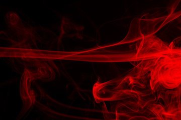 Red smoke abstract on black background, fire design and darkness concept