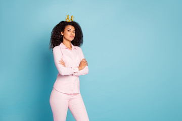 Photo of amazing dark skin curly model lady arrogant queen with crossed arms looking strict on...