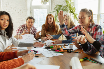 Teamwork. Young people discussing about women rights and equality at the office. Caucasian businesswomen or office workers have meeting about problem in workplace, male pressure and harassment.